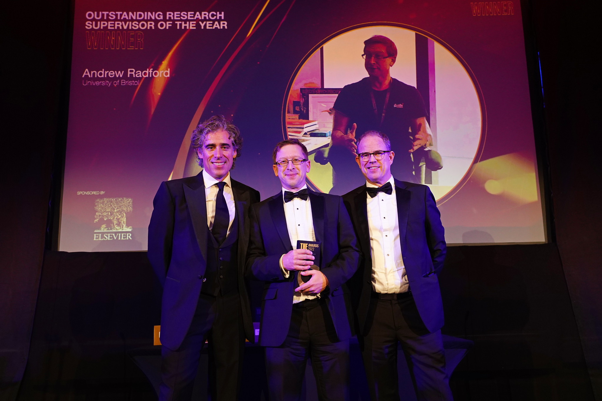 Image of Prof. Andy Radford with THE award